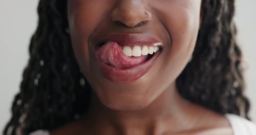 Woman, mouth and lick teeth for dental, health and wellness with cleaning for plaque on white