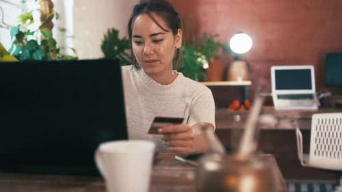 Woman Shopping Online at Home With Laptop