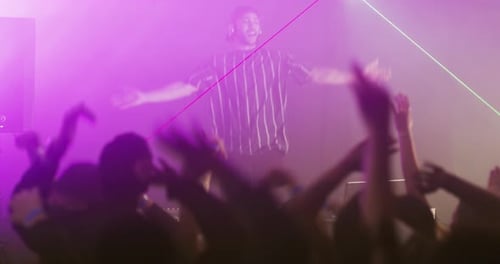 Dj, audience and dancing for fun, nightclub and energy or entertainment, freedom and man jumping