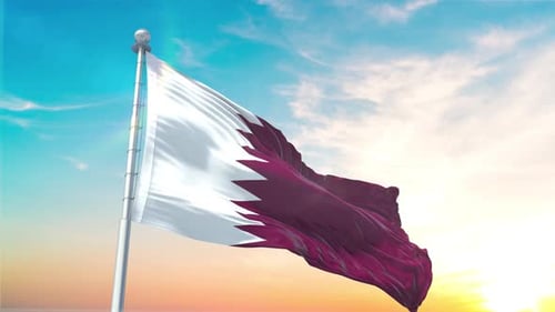 Waving Qatar National Flag Against a Bright Blue Sky