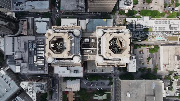 Top down rotating footage of high rise downtown buildings in modern ...