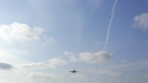 passenger airplane flies in the sky, approaching the airport