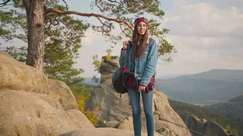 Amazing Young Attractive Caucasian Woman Hiker Adventurer Traveler with Tourist Backpack Standing on