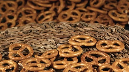 Golden Baked Pretzels Piled on Woven Background