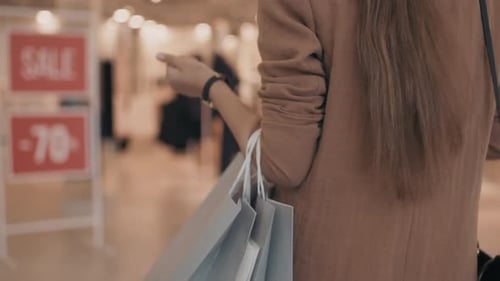 Woman Heading to Fashion Store – Face Not Visible