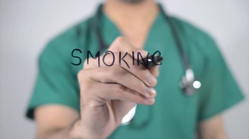 Doctor Writes Smoking on Clear Surface