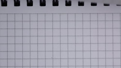 Close Up of Grid Paper in Spiral Notebook