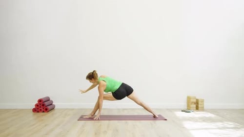 Woman in energized bridge pose outdoors