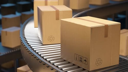 Cardboard boxes moving on a warehouse conveyor belt system