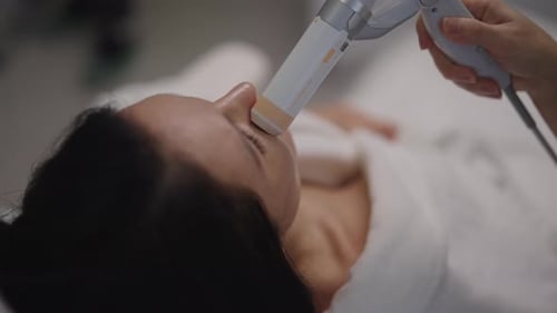 Closeup of Female Receiving Focused Ultrasound Facial Lifting Procedure for Skin Tightening