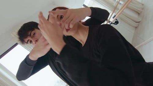 Duet Looking at Camera during Contemporary Dance in Studio