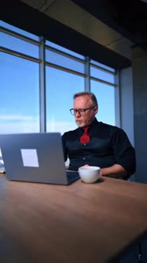 Man Working at Desk in Office