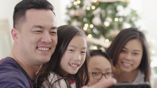 Happy Family Taking Selfie at Home During Christmas