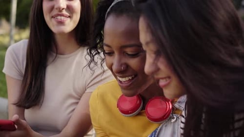 Close Up Faces Happy Young Women Using Cell Phone Outdoors