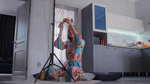 Creative Home Scene with Woman Making Macrame