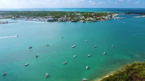 Sailboats Anchored Off Shore Near Island Aerial