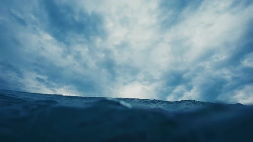 Ocean wave breaks on the shore. Wave rolls and breaks over the coastal area. Underwater camera