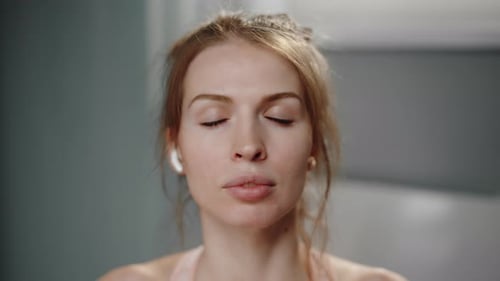 Woman Talking with Eyes Closed Indoors