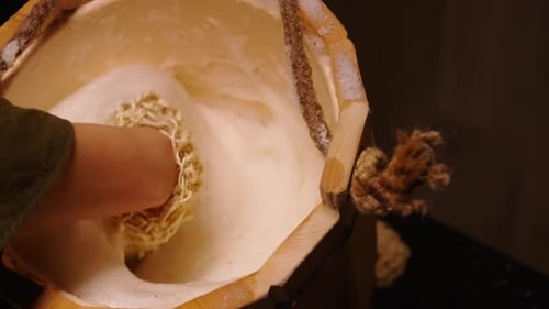 Beauty Treatments In SPA Center Traditional Soap Massage For Exfoliating Skin Closeup Loofah Glove