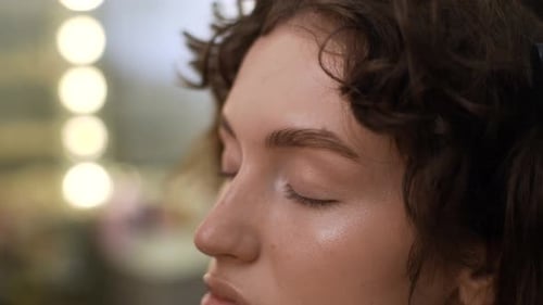 Makeup Artist Shapes Eyebrows of Model
