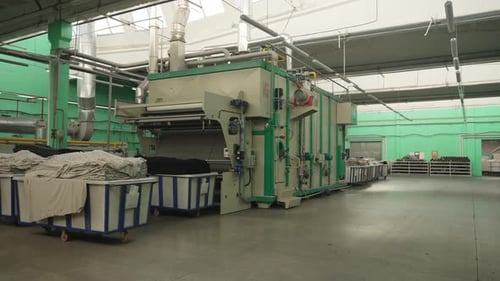 Industrial Laundry Facility with Machinery and Linen Baskets Concept Industrial Cleanliness