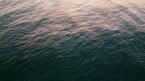 Closeup Sea Rippling Surface Reflecting Morning Sun. Drone View Calm Blue Summer Lagoon Super Slo...