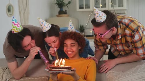 Friends Celebrating Birthday with Cake Indoors