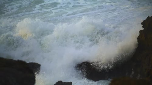 Huge Waves Hit Rocks Beach in Closeup. Dangerous Ocean Water