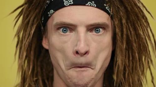 Man with Dreadlocks Making Funny Facial Expressions
