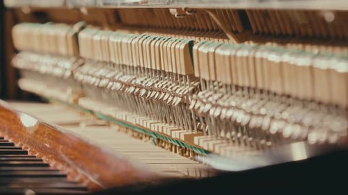 Close-Up of Acoustic Upright Piano with Visible Inner Mechanism