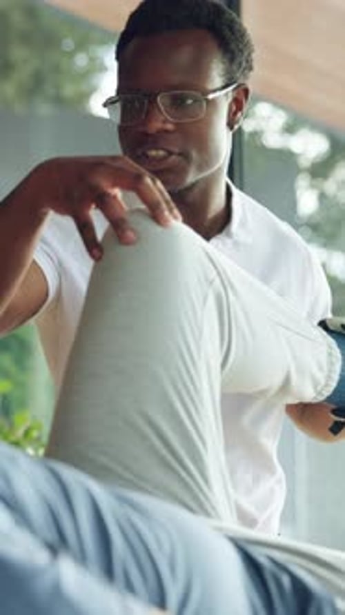 Physiotherapy, knee exercise and physiotherapist with patient in office for muscle mobility