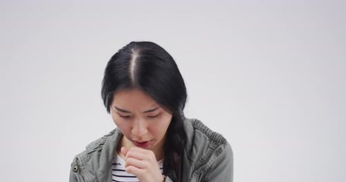 Woman Coughing into Hand, Close Up Studio Shot