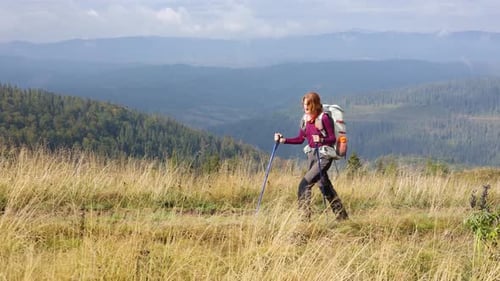 Girl Hiker Walking By The Grassy Mountain Hill 2