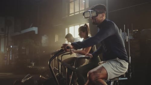 Adults Exercising in Gym, Man Using VR Headset