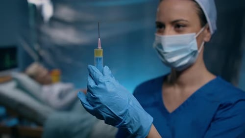 Doctor Holding Syringe in Hospital, Coronavirus Concept