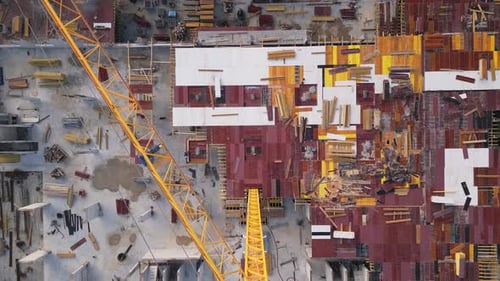 Construction Site Overview Showcasing Equipment and Materials During a Building Project in Progress