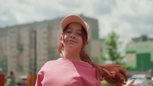 Smiling Teen Girl Posing in an Urban Setting