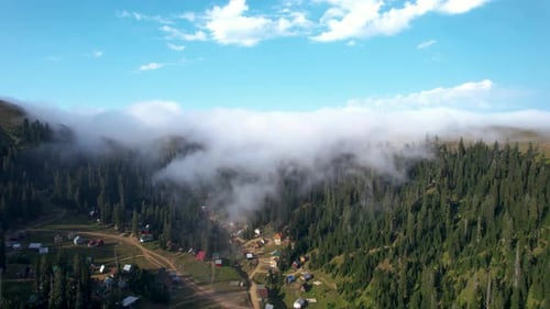 Fog Is Coming Over The Mountain Village