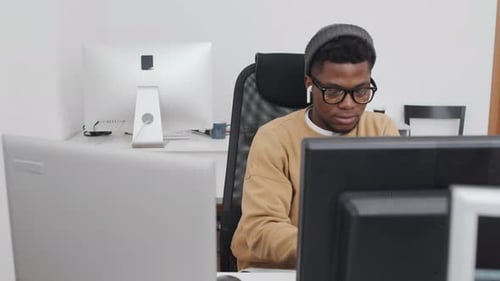 Portrait of Young Man Focused on Work in Office