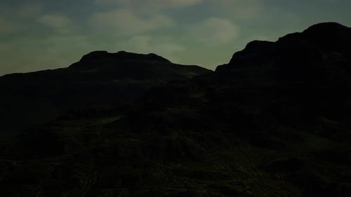 High Ridges Shrouded in Thick Fog with Faint Green Highlights