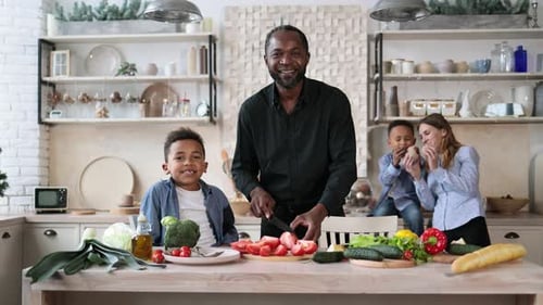 Family Prepares Vegetables Together in Modern Kitchen