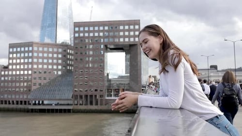 Young beautiful woman portrait in the city, slow motion shot