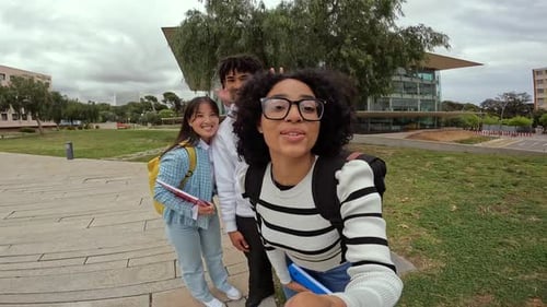 Three Students Smiling on University Campus