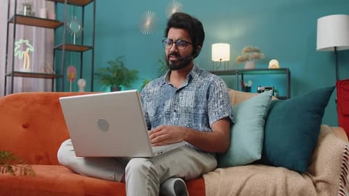 Indian Man Freelance Worker Call Center or Support Service Operator Helpline Having Talk with Client