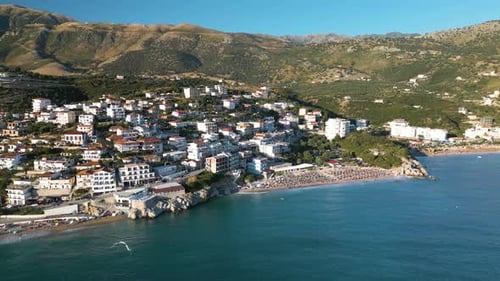 Cinematic Establishing Drone Shot Above Popular Beach in Himare, Albania