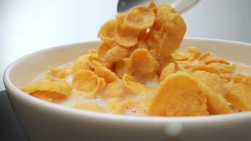 Cornflakes and Milk with Spoon Close-Up