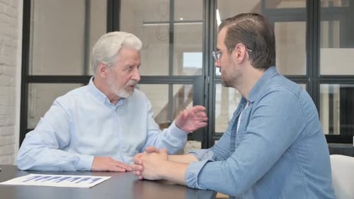 Business People Discussing Project in Office