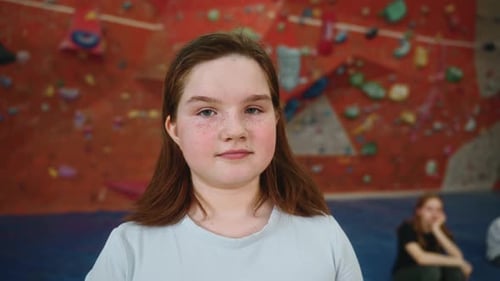 Smiling Girl Portrait in Climbing Gym