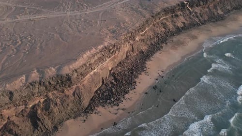 Sand beach under the cliff aerial view