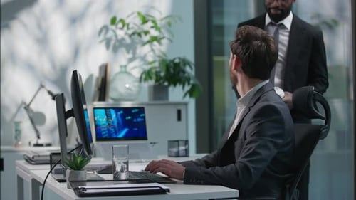 Men in Suits Chatting Over Coffee in Office